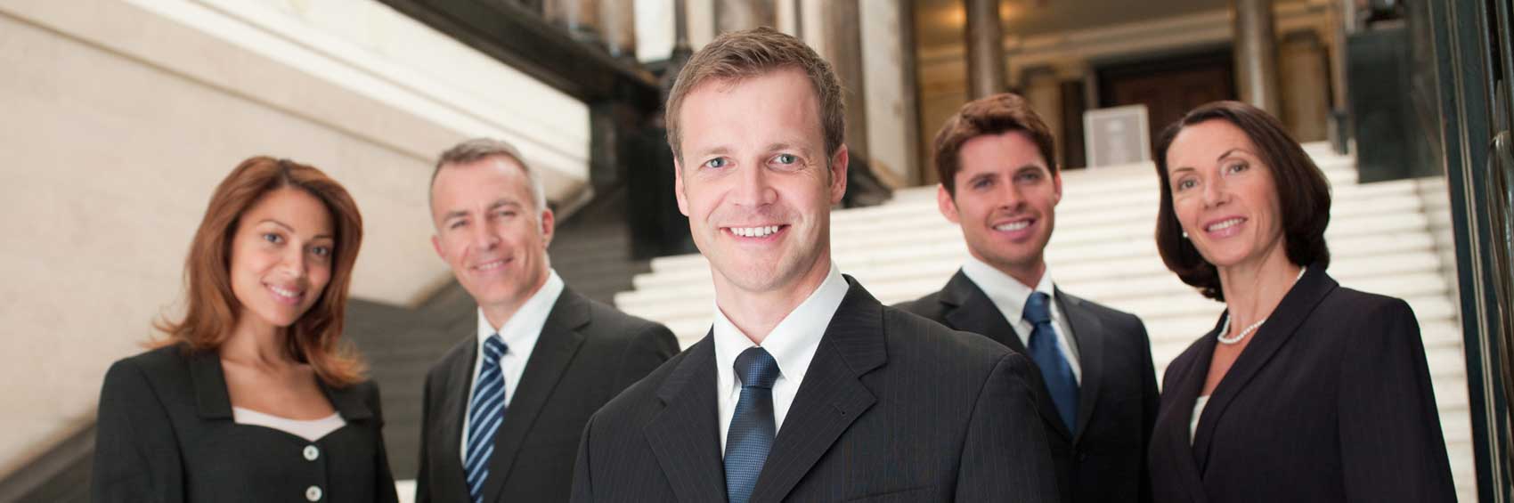 group of business people standing in front of stairs. commercial business insurance